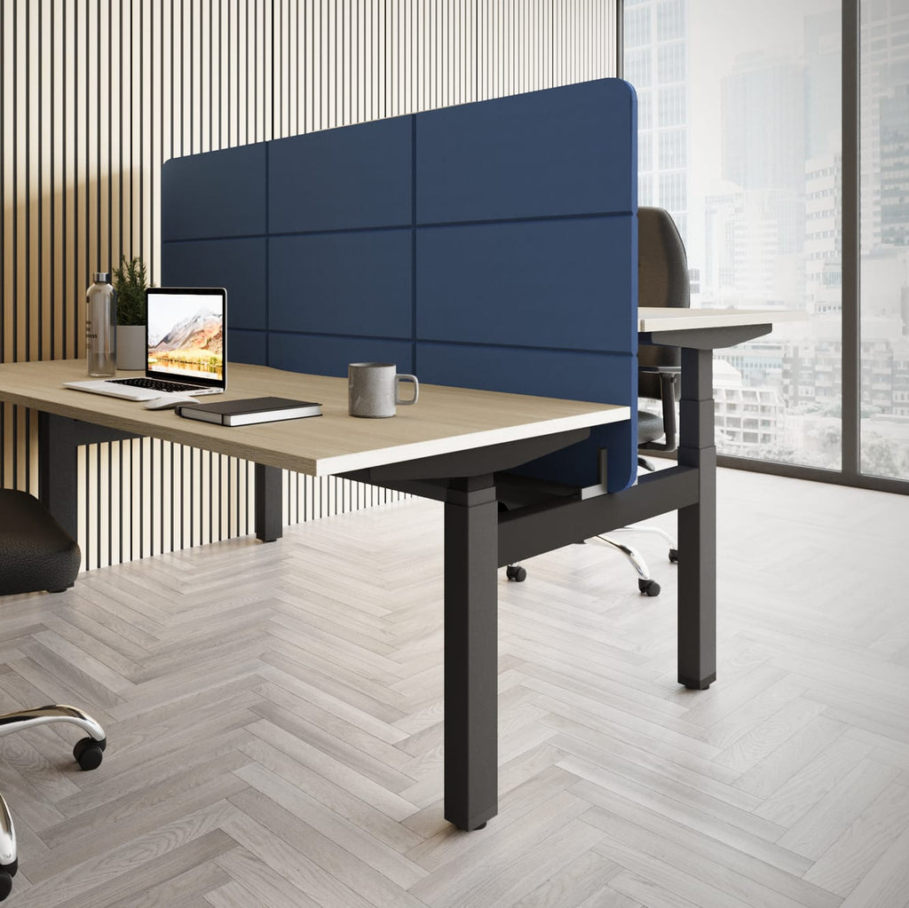 Modern office desk setup with a chair, computer, and blue partition.