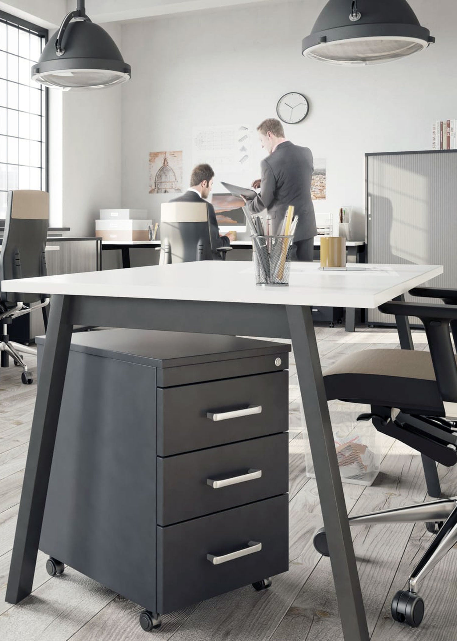Modern office with a desk and storage unit, featuring a person working.