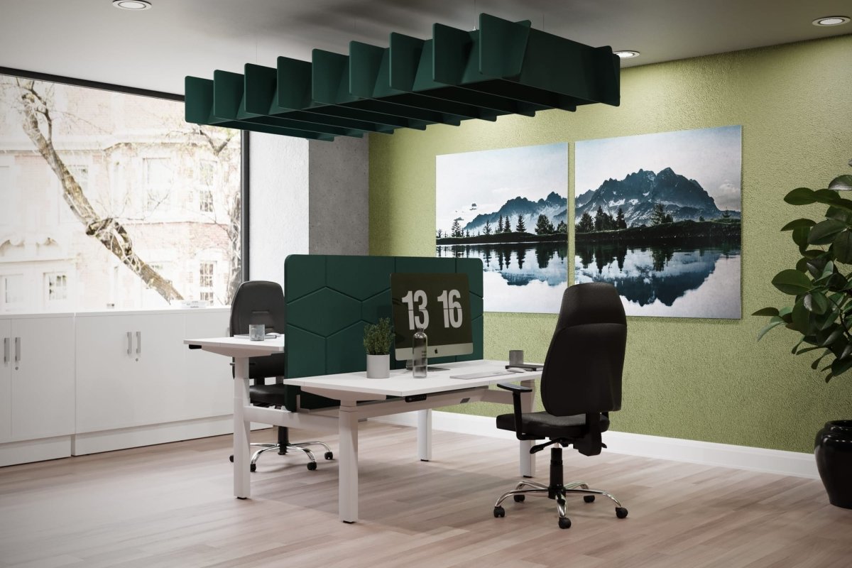 Modern office space with a desk, chairs, and wall art depicting a landscape.