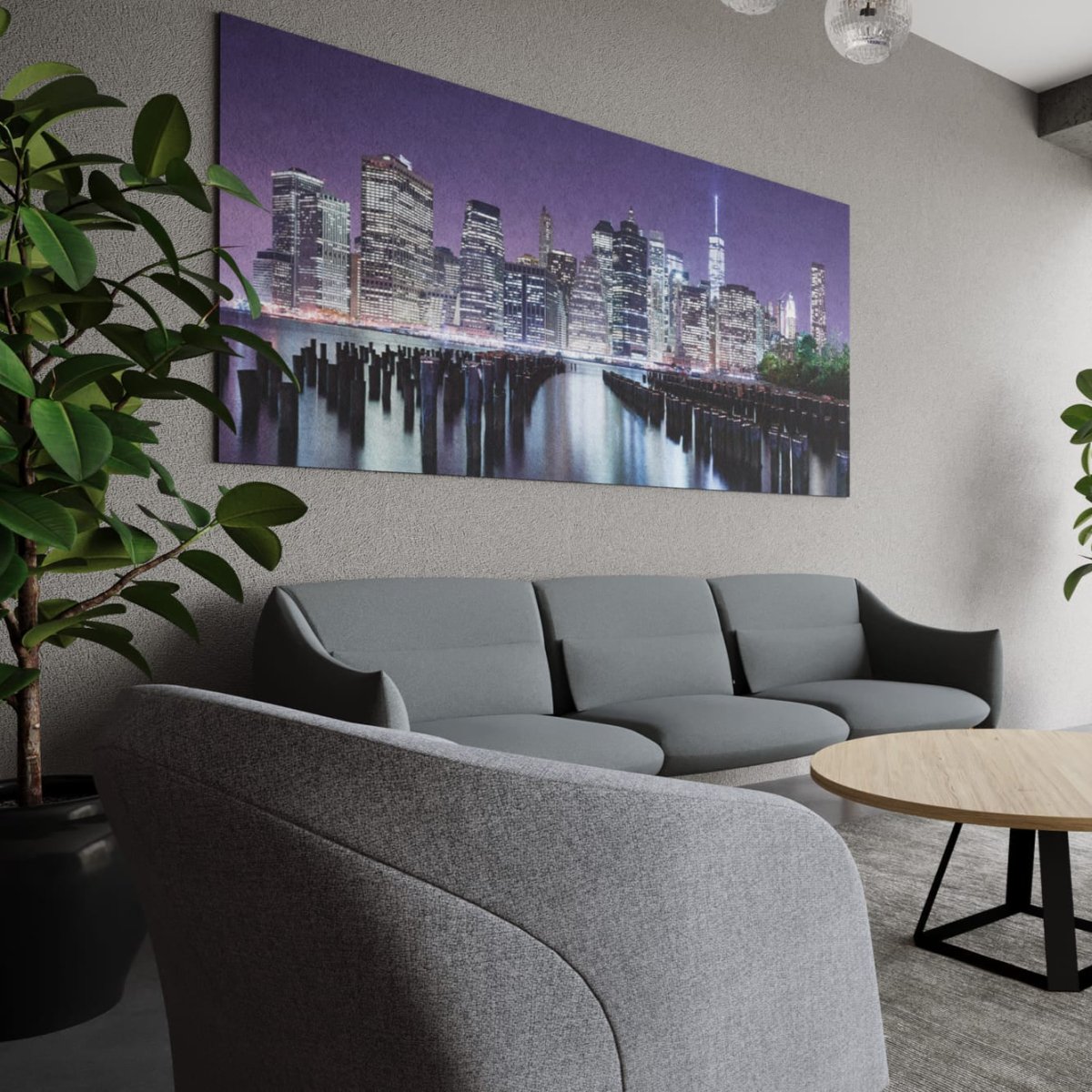 Modern living room with gray sofa, round wooden coffee table, and cityscape wall art.