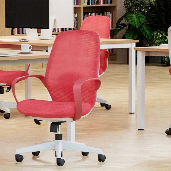 Modern office setup with red chairs and a white desk in a well-lit room.