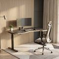 Modern home office with a desk, chair, and computer setup.