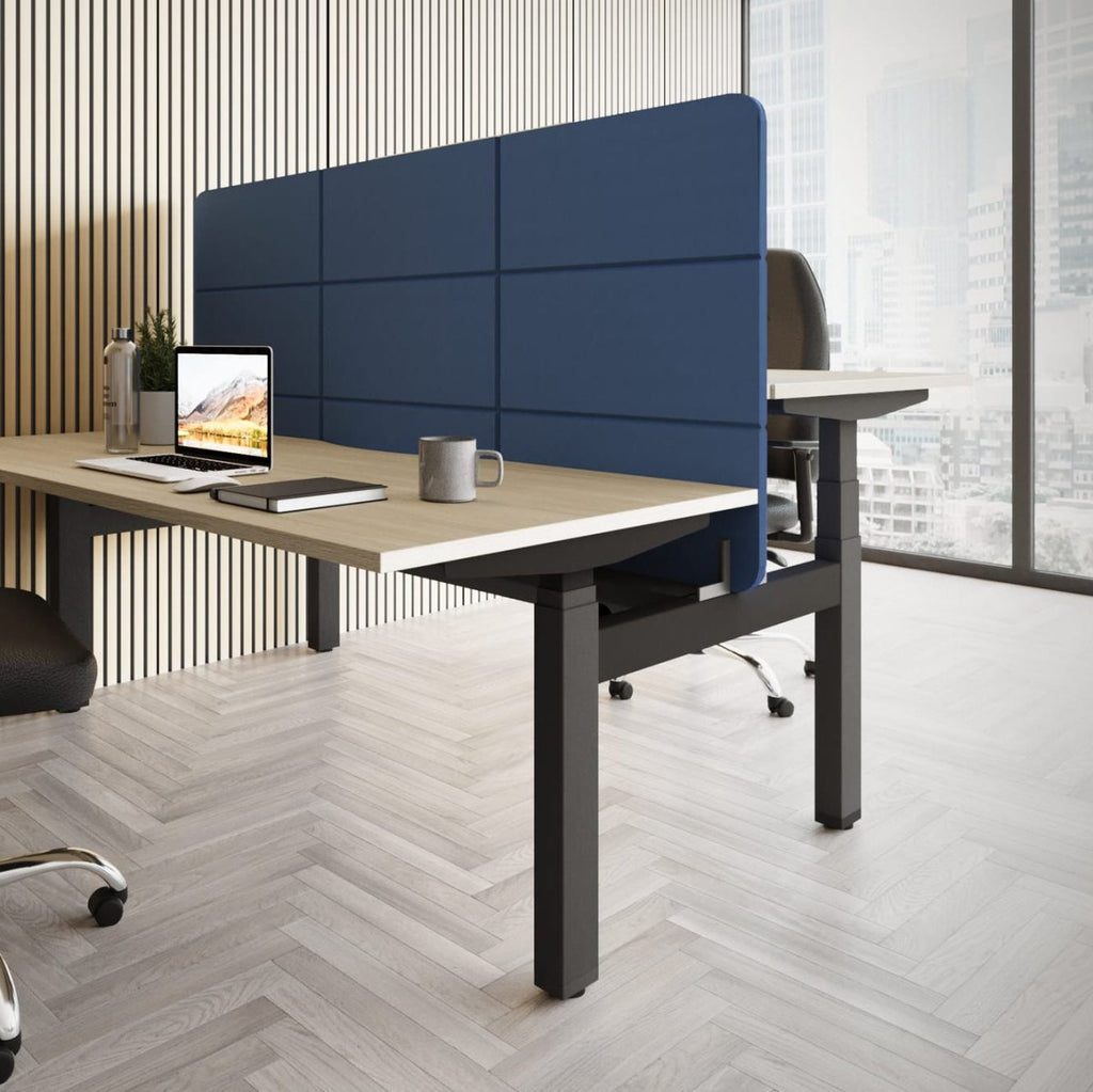 Modern office desk setup with a chair, computer, and blue partition.