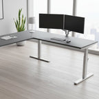 L-shaped desk with gray top and white legs on a white background