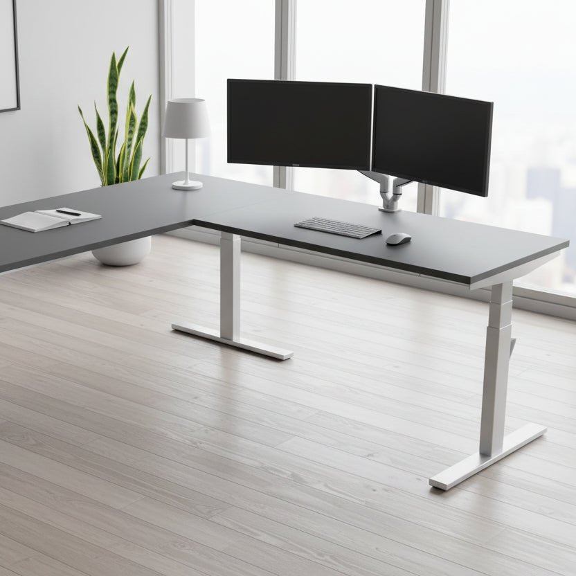 L-shaped desk with gray top and white legs on a white background