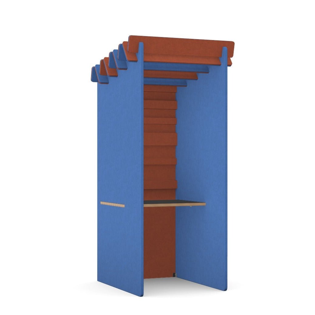 Colorful acoustic booth with blue and orange panels and built-in desk for workspaces