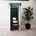 Office phone booth with acoustic panels and workspace