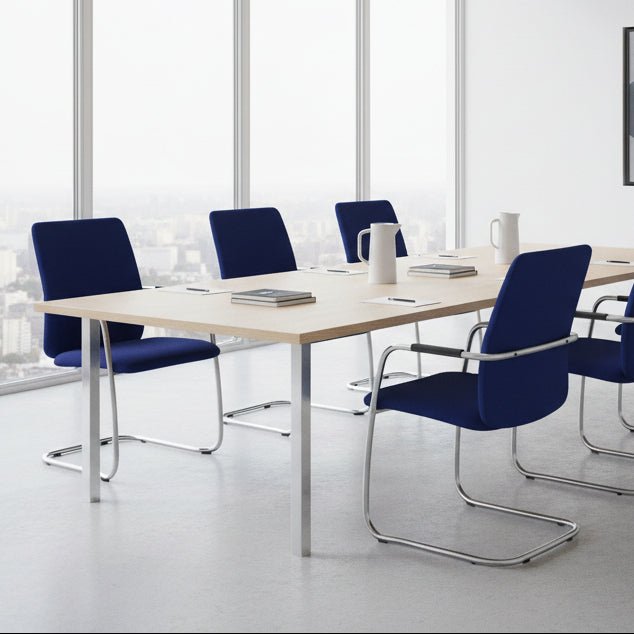 A modern blue upholstered chair with a cantilever chrome metal frame, shown against a plain white background.