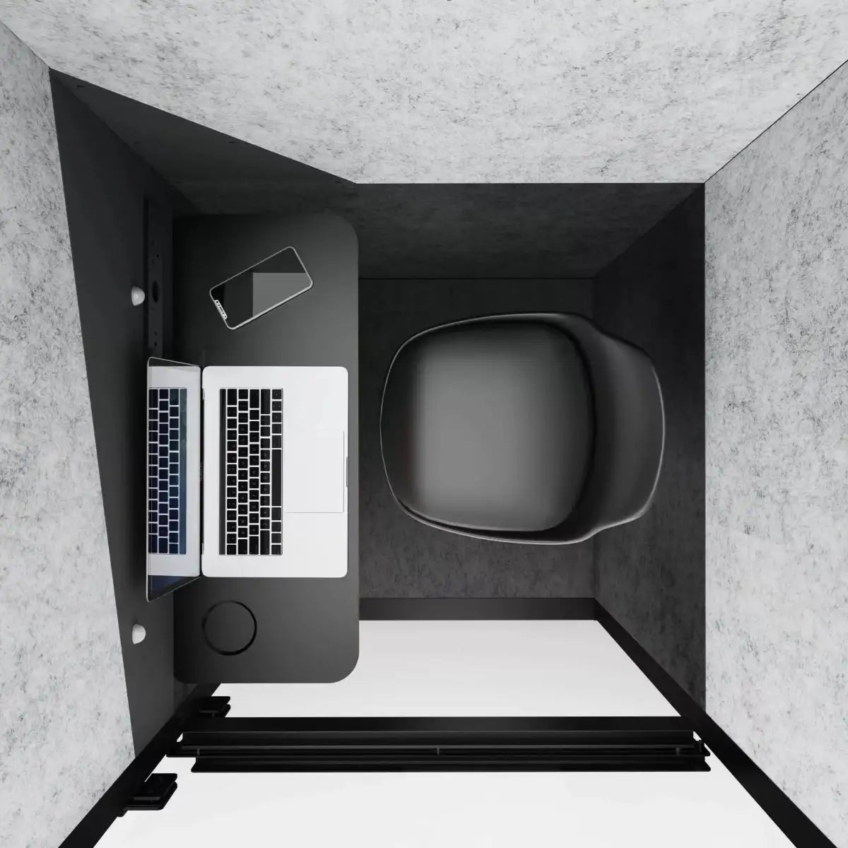 Small office desk with laptop, phone, and mug in a compact space.