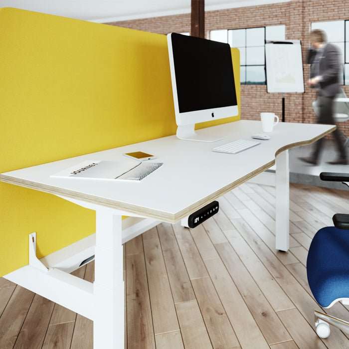 Contemporary office desk with computer setup and yellow partition